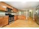 Eat-in kitchen with stainless steel appliances and hardwood floors at 1421 E New York St, Indianapolis, IN 46201