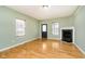 Living room with hardwood floors and a fireplace at 1421 E New York St, Indianapolis, IN 46201