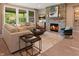 Spacious living room featuring a stone fireplace and large windows at 1500 E Greyhound Pass, Carmel, IN 46032