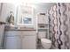 Well-lit bathroom with a vanity, shower and storage at 15428 Wandering Way, Noblesville, IN 46060