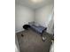 Small bedroom with a bed and chair at 2018 N Dearborn St, Indianapolis, IN 46218