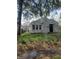 Cozy single-story home with a fenced yard and mature shade tree at 2018 N Dearborn St, Indianapolis, IN 46218