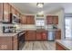 Modern kitchen with stainless steel appliances and wood cabinets at 2114 St Clifford Dr, Indianapolis, IN 46239