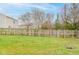 Large fenced backyard with grassy area at 2716 Redland Ln, Indianapolis, IN 46217