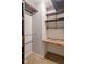 Walk-in closet featuring shelves, rod, and workspace at 2716 Redland Ln, Indianapolis, IN 46217