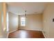 Simple dining room with hardwood floors and a light-colored wall at 2716 Redland Ln, Indianapolis, IN 46217