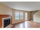 Living room features hardwood floors, fireplace, and patio door access at 2716 Redland Ln, Indianapolis, IN 46217