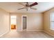 Main bedroom with ceiling fan and access to bathroom at 2716 Redland Ln, Indianapolis, IN 46217