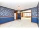 Bright dining room features floral wallpaper and a chandelier at 3226 W 8Th St, Anderson, IN 46011