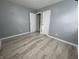 Simple bedroom with gray walls and light wood-look floors at 3305 E 30Th St, Indianapolis, IN 46218