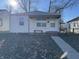 Cute bungalow with a covered porch, steps, and small front yard at 3305 E 30Th St, Indianapolis, IN 46218