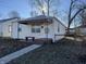 Adorable bungalow featuring a covered porch and a landscaped yard at 3305 E 30Th St, Indianapolis, IN 46218