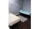 Bright bedroom featuring two twin beds, hardwood floors, and tasteful wall art at 34 Iowa St, Indianapolis, IN 46225