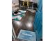 Dark hardwood floors, teal door, welcome mat, and a rug at 34 Iowa St, Indianapolis, IN 46225