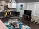 Open living area with dark hardwood floors, gray walls, and a modern aesthetic at 34 Iowa St, Indianapolis, IN 46225