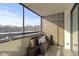 Spacious balcony with wicker furniture and screened enclosure, offering tranquil views at 4000 N Meridian St # 3A, Indianapolis, IN 46208