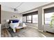 Spacious bedroom with wood flooring, large windows, and a ceiling fan at 4000 N Meridian St # 3A, Indianapolis, IN 46208