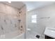 Bathroom featuring tiled walls and floor, updated fixtures, and a vanity with a sink at 4014 N Capitol Ave, Indianapolis, IN 46208