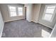 Bedroom features gray walls, new carpet, baseboard trim, and natural light at 4014 N Capitol Ave, Indianapolis, IN 46208