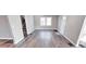 Bright living room showcasing hardwood floors and a large window for plenty of natural light at 4014 N Capitol Ave, Indianapolis, IN 46208
