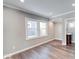 Well-lit living room with hardwood floors and easy access to bathroom and kitchen at 4014 N Capitol Ave, Indianapolis, IN 46208