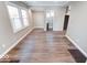 Bright living room featuring hardwood floors, with easy access to bathroom and kitchen at 4014 N Capitol Ave, Indianapolis, IN 46208