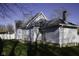 Rear view of house with white siding, grassy yard and white fence at 4870 Parker St, Clayton, IN 46118