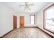 Bright bedroom with hardwood floors, ceiling fan, and two large windows at 503 S Harrison St, Alexandria, IN 46001