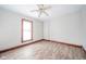 Spacious bedroom with hardwood floors, ceiling fan, and large windows at 503 S Harrison St, Alexandria, IN 46001
