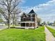 Beautiful brick home with tower and a spacious yard, offering a blend of classic charm and outdoor space at 503 S Harrison St, Alexandria, IN 46001