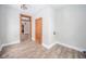 Bright hallway with hardwood floors and vintage doors leading to other rooms at 503 S Harrison St, Alexandria, IN 46001