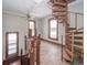 Upper level landing with spiral staircase and hardwood floors at 503 S Harrison St, Alexandria, IN 46001