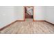 Hardwood floor living room with view into the entryway and staircase at 503 S Harrison St, Alexandria, IN 46001