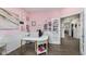 Stylish home office with desk, storage, and pink walls at 507 Buckthorn Ln, Sheridan, IN 46069