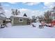 House's backyard in the winter with snow on the ground at 5233 Chelsea Rd, Indianapolis, IN 46241