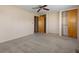 Empty bedroom with neutral walls, carpet, and double closets at 5249 Hickory Rd, Indianapolis, IN 46239