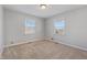 Spacious bedroom with neutral walls and carpet flooring at 5249 Hickory Rd, Indianapolis, IN 46239