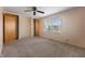 Bright bedroom featuring wood closets and neutral carpeting at 5249 Hickory Rd, Indianapolis, IN 46239