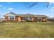 Brick ranch house with a spacious lawn and mature trees at 5249 Hickory Rd, Indianapolis, IN 46239