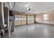 Attached two-car garage with epoxy flooring and utility sink at 5249 Hickory Rd, Indianapolis, IN 46239