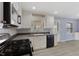 Modern kitchen with stainless steel appliances and white cabinets at 5249 Hickory Rd, Indianapolis, IN 46239