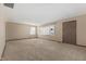 Bright living room with neutral carpeting and lots of natural light at 5249 Hickory Rd, Indianapolis, IN 46239