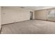 Spacious living room with neutral carpeting and large windows at 5249 Hickory Rd, Indianapolis, IN 46239