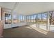 Sunroom with view of backyard, neutral carpet and bright windows at 5249 Hickory Rd, Indianapolis, IN 46239