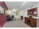 Finished basement with home office and built-in cabinetry at 6023 Twyckenham Dr, Indianapolis, IN 46236