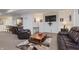 Finished basement features a comfortable seating area, a home office, and a kitchenette at 6023 Twyckenham Dr, Indianapolis, IN 46236