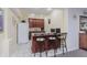 Small, well-equipped basement kitchenette with bar seating at 6023 Twyckenham Dr, Indianapolis, IN 46236