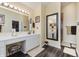 Bathroom with double vanity, large mirror and shower at 6023 Twyckenham Dr, Indianapolis, IN 46236