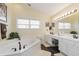 Large bathroom with double vanity and corner soaking tub at 6023 Twyckenham Dr, Indianapolis, IN 46236