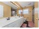 Bathroom with double vanity and shower at 6023 Twyckenham Dr, Indianapolis, IN 46236
